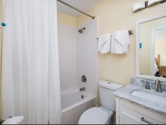 The master bathroom has a shower/tub combo