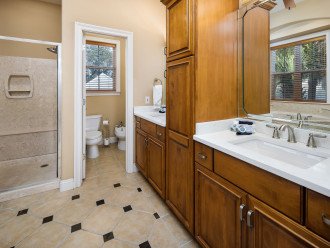 The master bathroom has 2 separate vanities and a walk in shower