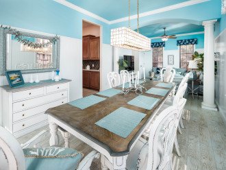 The large dining room table has a bench seat and plenty of room for the whole family