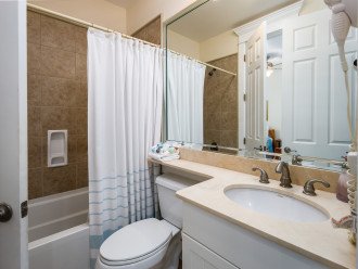 Second level guest bathroom with tub/ shower