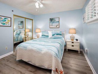 Guest bedroom with a large closet and queen bed