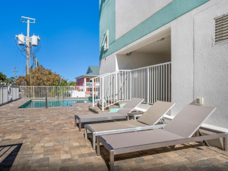 Communal pool deck with loungers