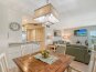 Spacious living room combines with dining area right off the kitchen