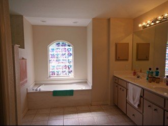 Master ensuite with bath tub and walk-in shower