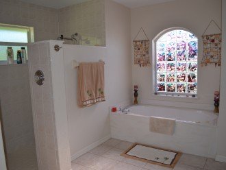 Master ensuite with bath tub and walk-in shower