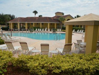 View of pool, cabanas and clubhouse