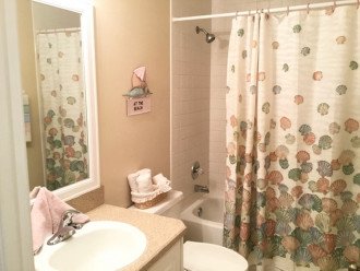 The guest hall bath has a tub/shower combination, with ample bath linens.