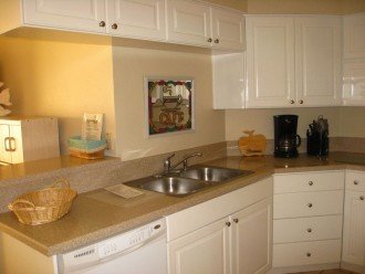 Kitchen features newer appliances, with solid oak cabinetry.