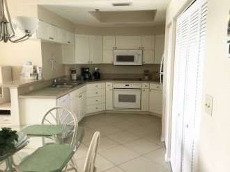 Kitchen features dishwasher, built-in oven/microwave and refrigerator & W/D.