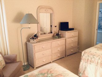 We have a sitting/reading space and a triple dresser and chest, with cable t.v..