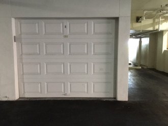 Garage door closed, with beach paraphernalia inside