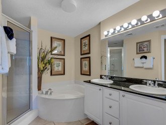 spacious bathroom with shower, soaking tub, double vanity & private toilet room