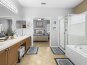 The master bathroom is a special relaxation oasis. Whether you prefer a quick shower or a long soak in the tub, this bathroom has everything you need to feel refreshed and rejuvenated.
