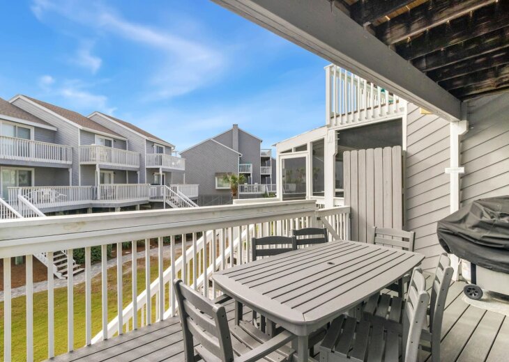 Fire up the gas grill on the covered deck and seat all six of you.