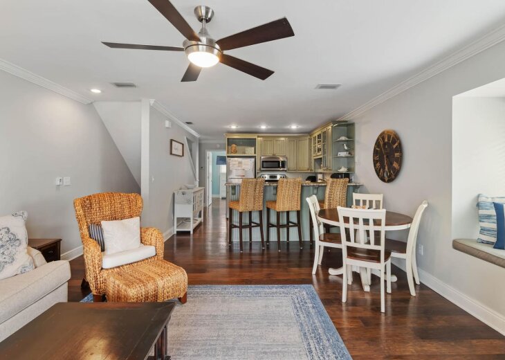 Settle in with the group: living room, dining and kitchen bar in one space.