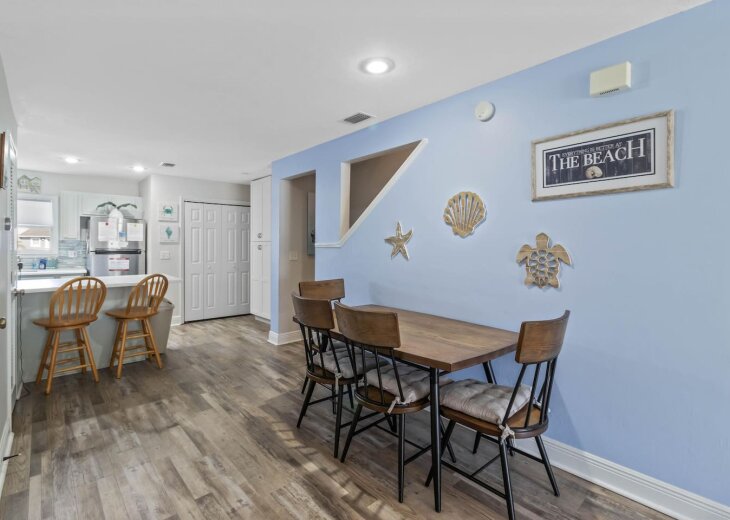 Grab a stool at the breakfast bar while someone sets the dining table.
