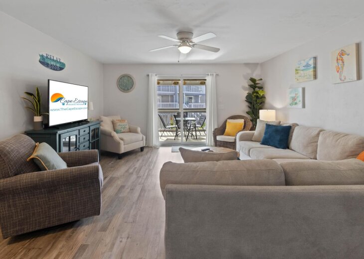 Kick back on the big sectional with the porch doors right behind you.