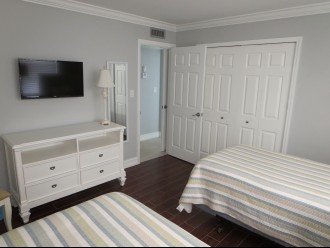 Both bedrooms have 32" wall mounted LCD TV's crown molding and tile floors.