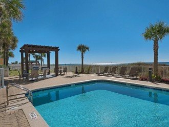 Outdoor pool, gas grills and lanai with dining area