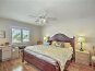 Master bedroom looks out at golf course.