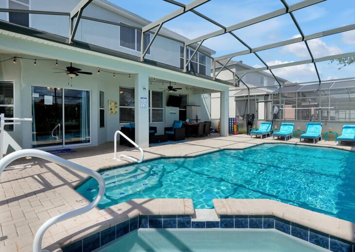 Heated private pool & spa on a screened lanai steps from the kitchen. Kids swim while grandparents relax under the fans & string lights. Handrails at pool & spa entries. A quiet retreat for families headed to Kissimmee for theme parks