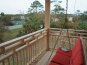 Front porch with porch swing, overlooks the bay