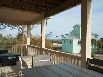 2nd Floor Deck w/ table seating for 9, sectional couch, gas grill + outdoor sink