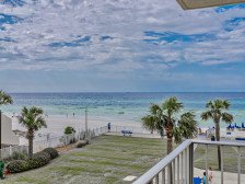 Updated Lower level Condo steps to beach, grills and pool! Tiki hut too!