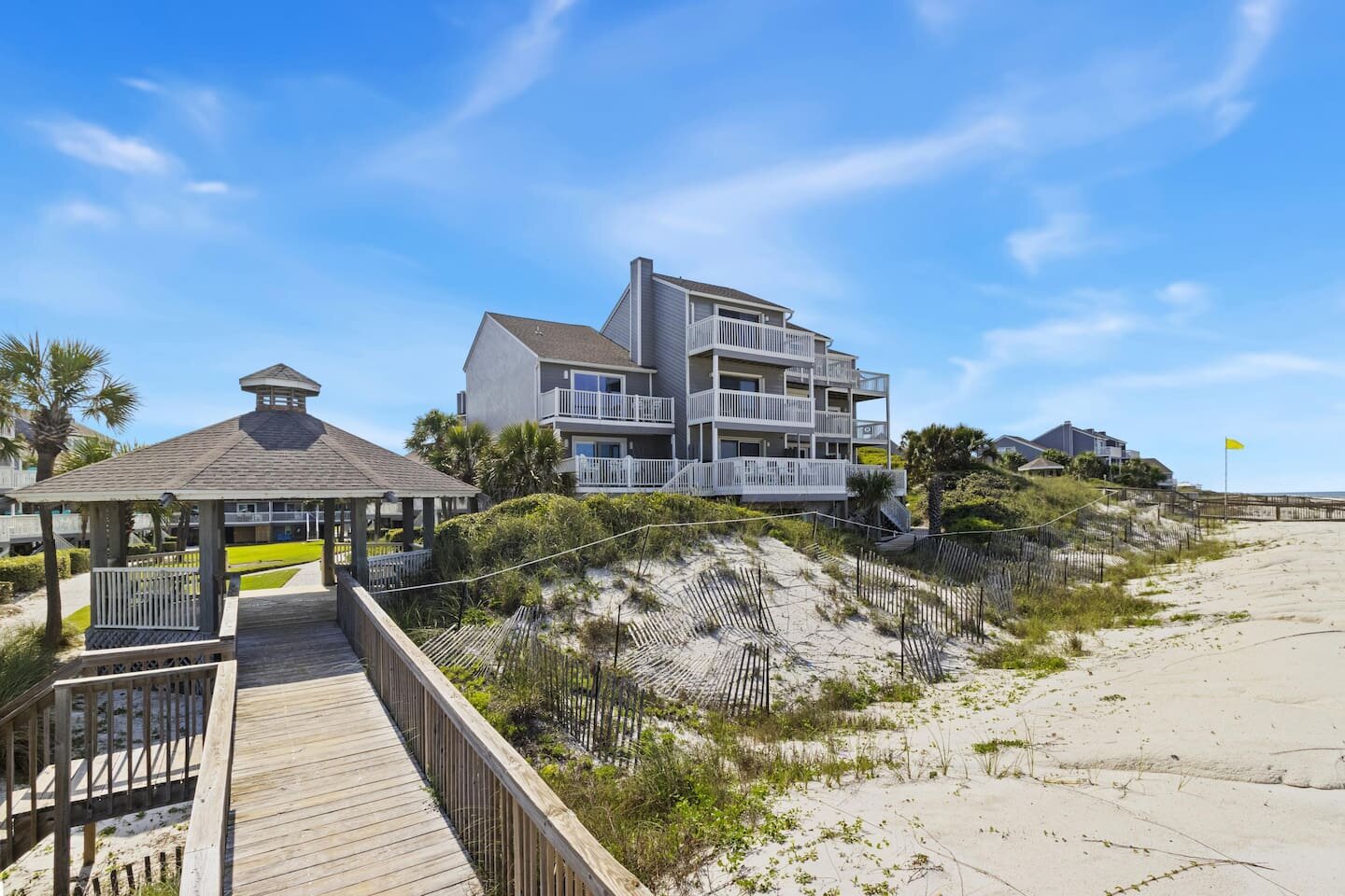 Step outside and take in all three Gulf-front decks at once — this is the home that lives as beautifully outside as it does inside.