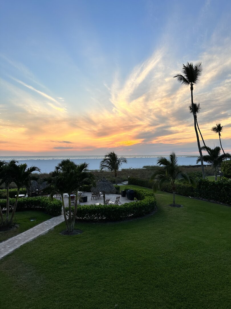 View from our Lanai of tiki hut with grills & seating