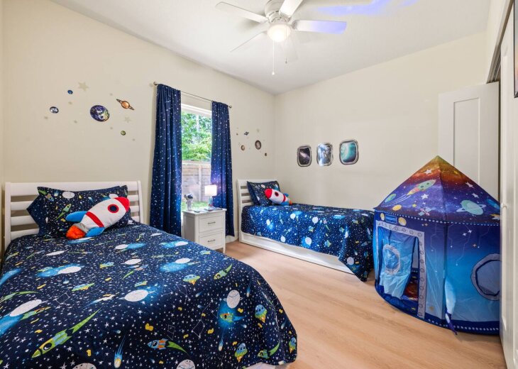 Out-of-this-world fun for kids of all ages—space-themed room with extendable tr