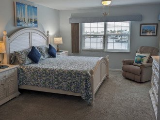 New bedroom carpeting 2024 with water view and lanai access.