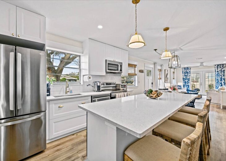 Kitchen Delight: Whip up tasty meals in this bright space with a large island and sleek appliances!