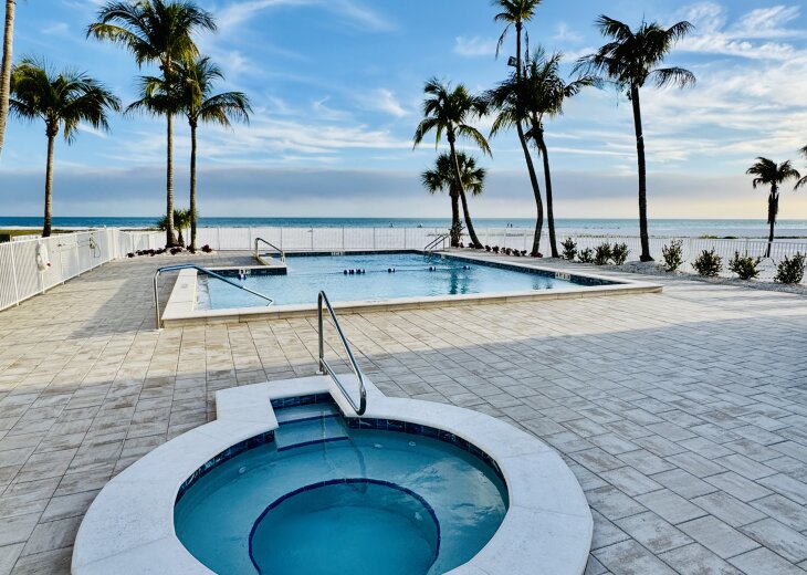 New beachfront spa and pool with private beach access.