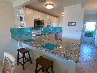 Newly remodeled kitchen with bar stools