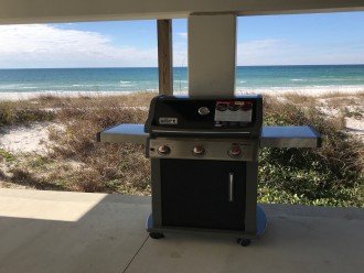 Weber Grill area overlooking beach, table and chairs for 6