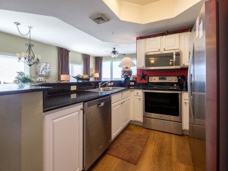 Upscale, fully equipped kitchen w/ stainless appliances, granite counters & extra long breakfast bar