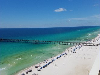 View to the west includes the beautiful sky, emerald coast, white sand beach