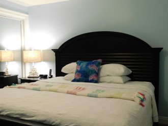 Restful master bedroom with comfortable king size bed & en suite bathroom