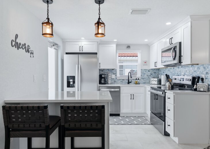 Brand new kitchen with island bar top seating