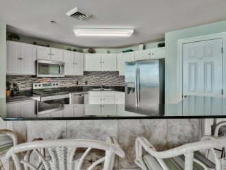 Upgraded kitchen has granite counters, lots of space & stainless steel appliances