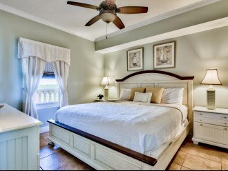 Restful guest bedroom with king size bed, dresser, large closet & flat screen TV