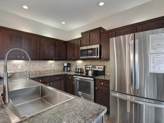 Kitchen with granite, stainless and eat-in breakfast bar
