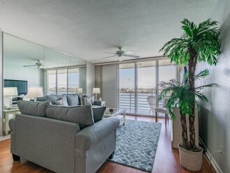 Waterfront 2BR condo with pool, hot tub, balcony, and water views.