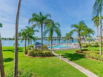 Waterfront 2BR/2BA condo in St. Petersburg with pool, hot tub, and beach access.