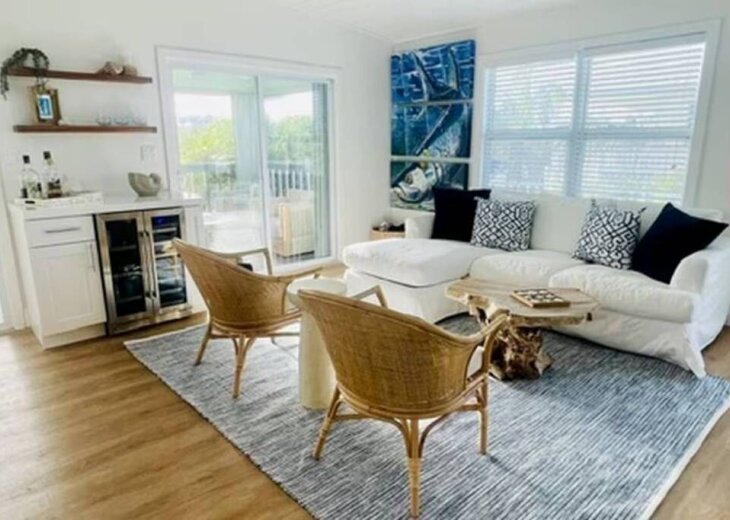 Living room has direct access to the second floor screened balcony.