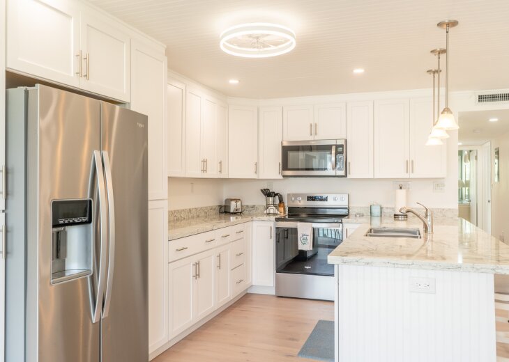 Newly renovated kitchen with granite countertops. Fully stocked kitchen.