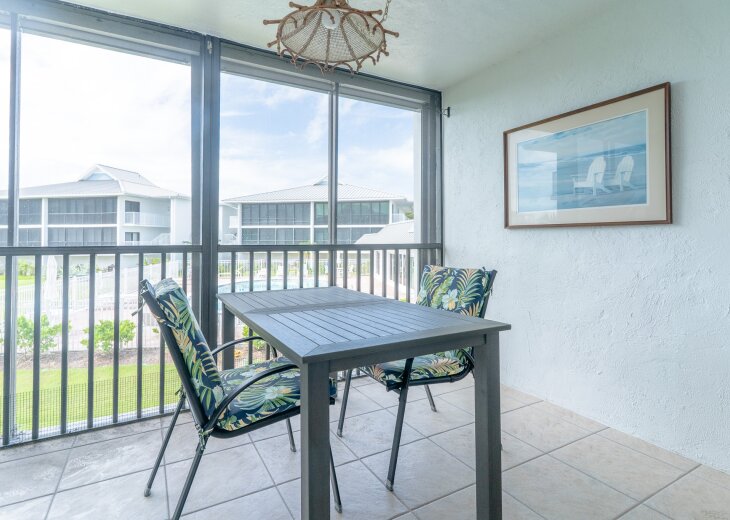 Screened in Lanai with views of gulf and pool.