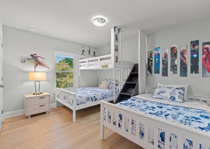 Two double beds and an additional twin bed on top