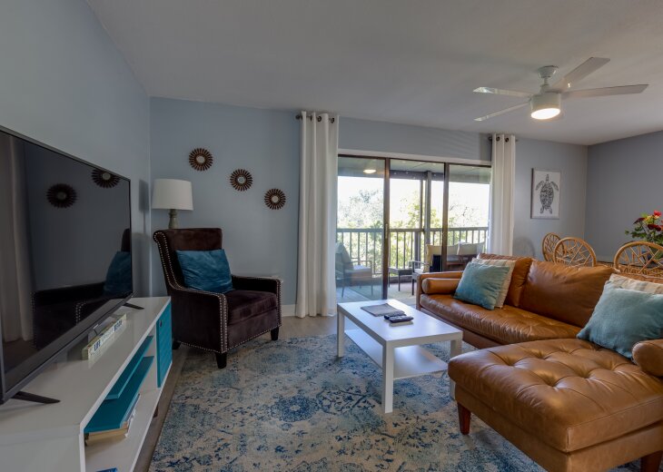 Open living area with sliders to the screened porch